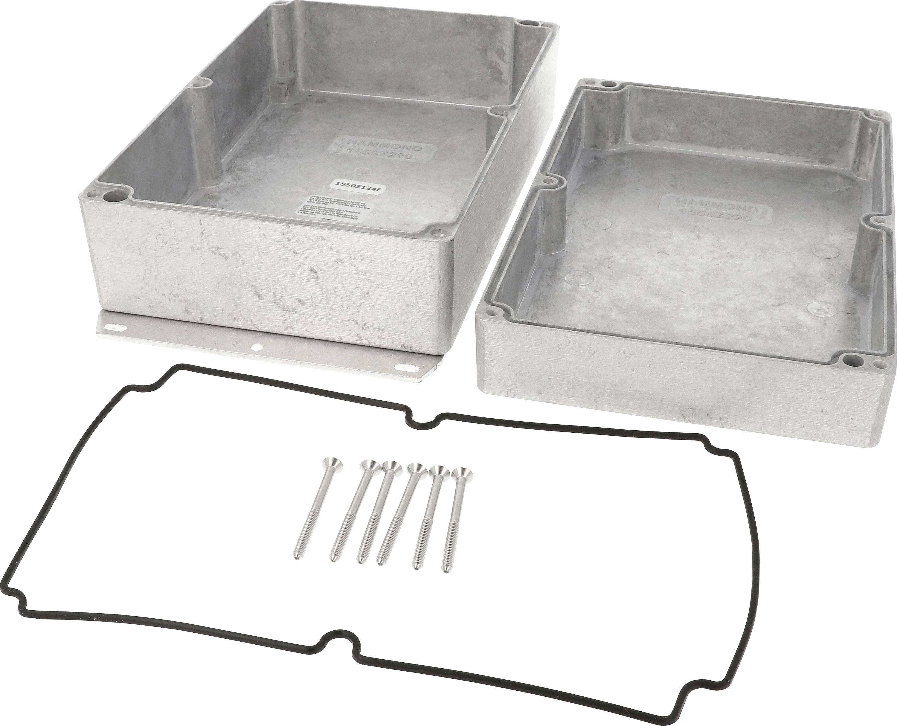 Two rectangular metal boxes, lying open with matching seals and small pins, on a white surface.