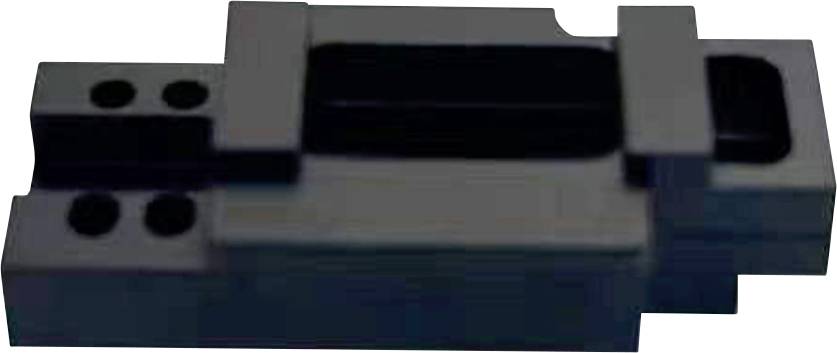 Dark component with multiple rectangular and cylindrical protrusions and recesses.