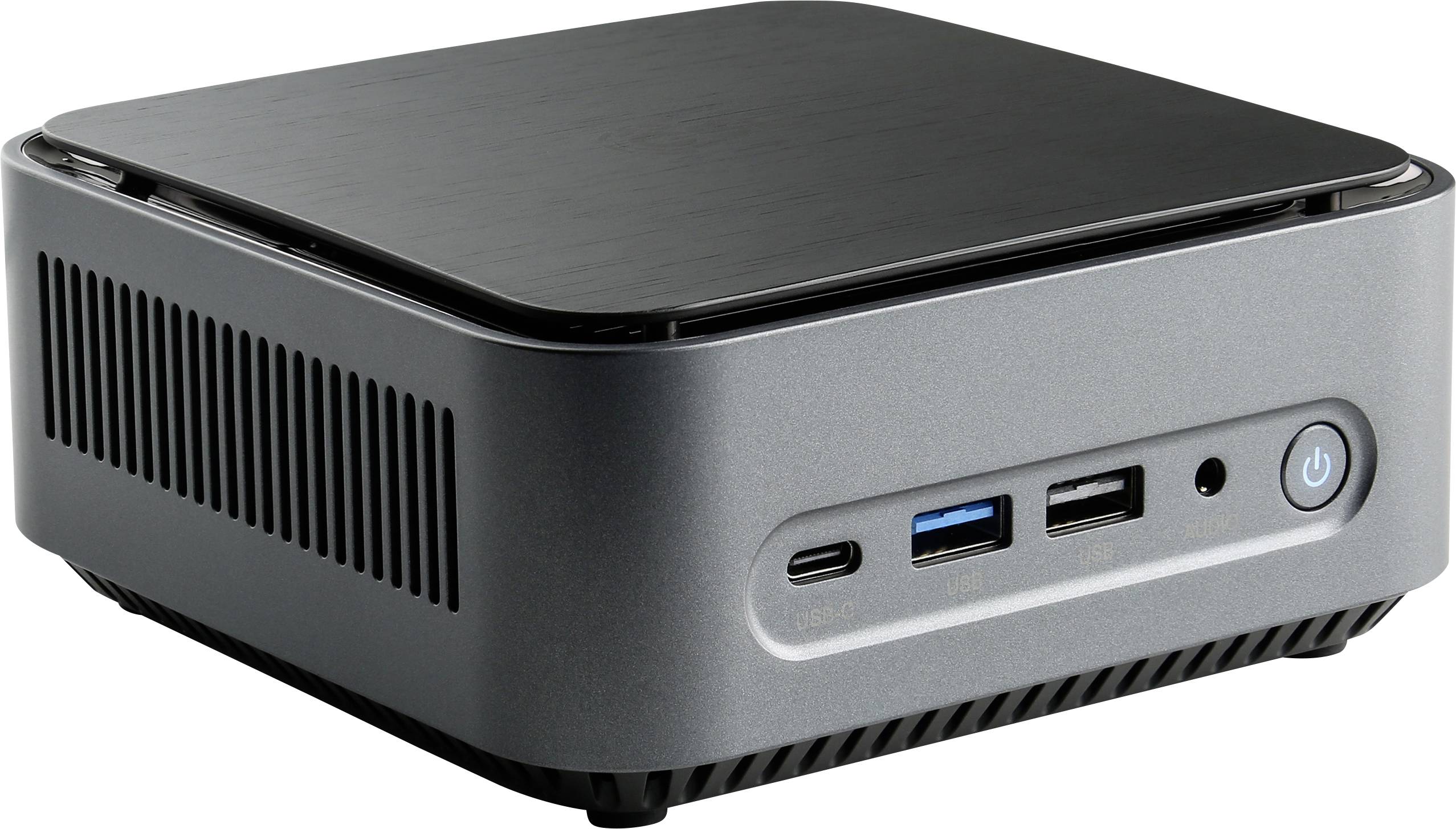 Small, rectangular mini PC with a silver casing. The front panel displays multiple connection ports and a power button.