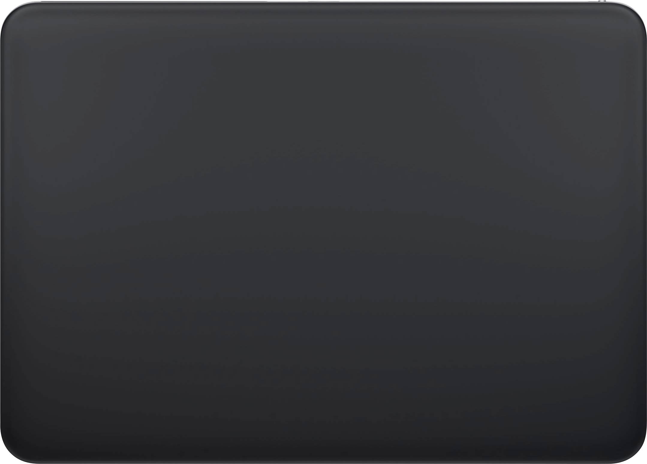 A closed, black laptop casing on a light surface.