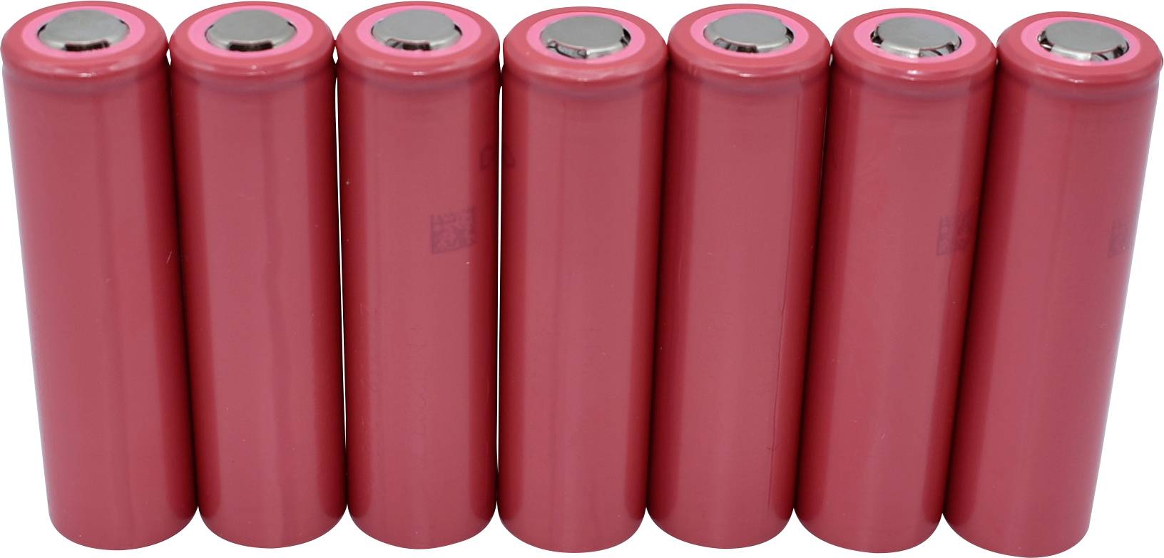 Seven red cylindrical batteries are standing upright next to each other.