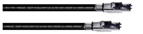 Two black Ethernet cables with silver connectors. On the cable is printed the text: 'DATA CATEGORY 6A + CORDIAL GERMANY'.