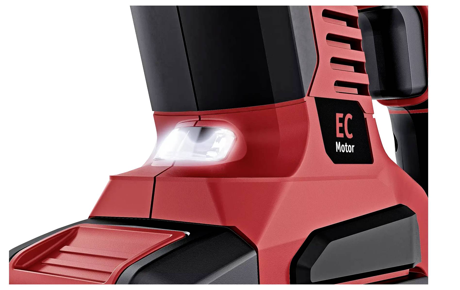 Red electric power tool with EC motor and illuminated switch, taken from a close-up perspective.