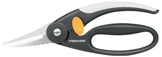 A black and orange pair of Fiskars scissors with a serrated blade, suitable for use in the kitchen or garden.