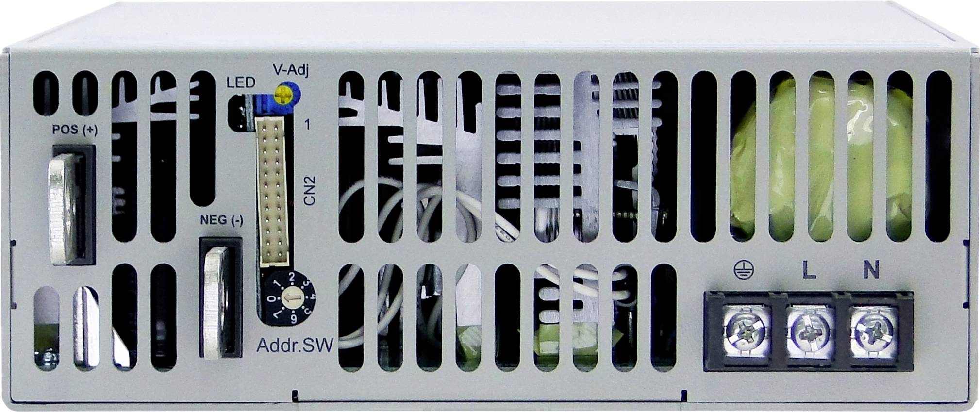 Back of an electronic device with ventilation slots, an LED display, a rotary dial for voltage adjustment, and power supply connections.
