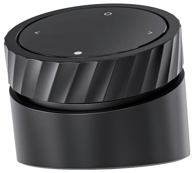A black, rotary volume control with buttons for volume and mute, positioned on an angled base.