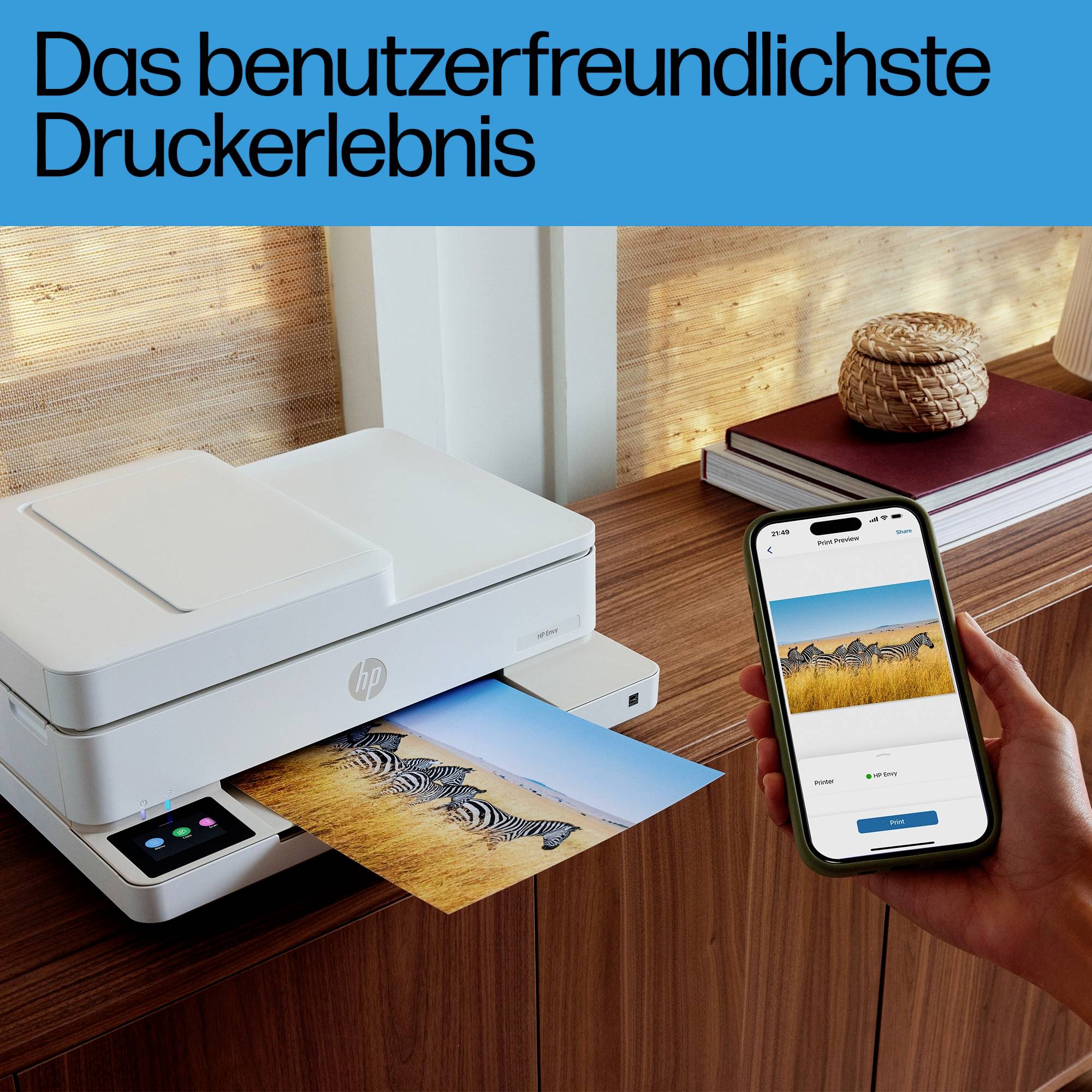 A printer is outputting a photo of zebras. Beside it, a hand is holding a smartphone with a print preview. Text at the top: 'The most user-friendly printing experience'.