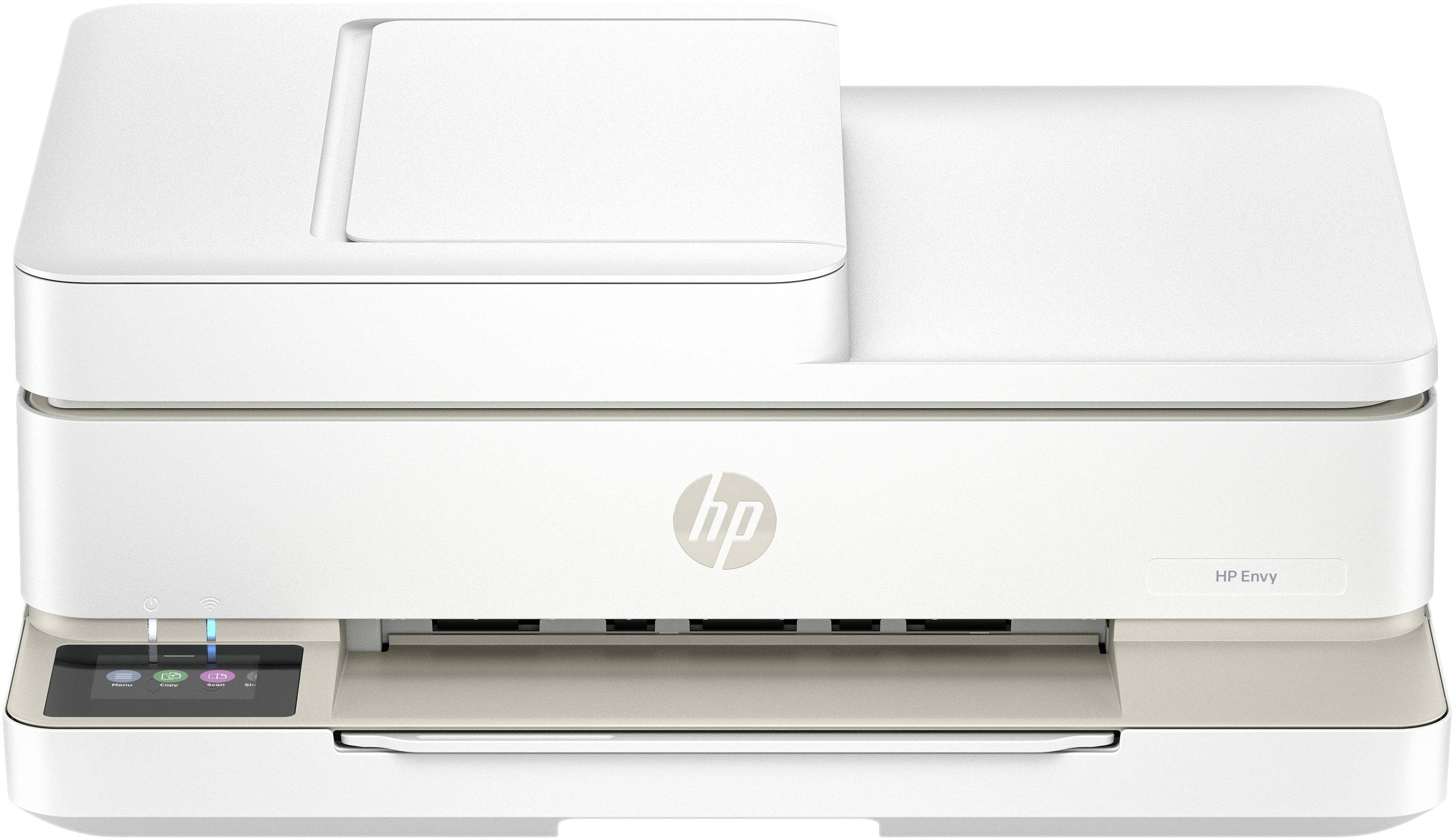 White HP Envy multifunction printer with paper feed at the top, control panel located at the front left.