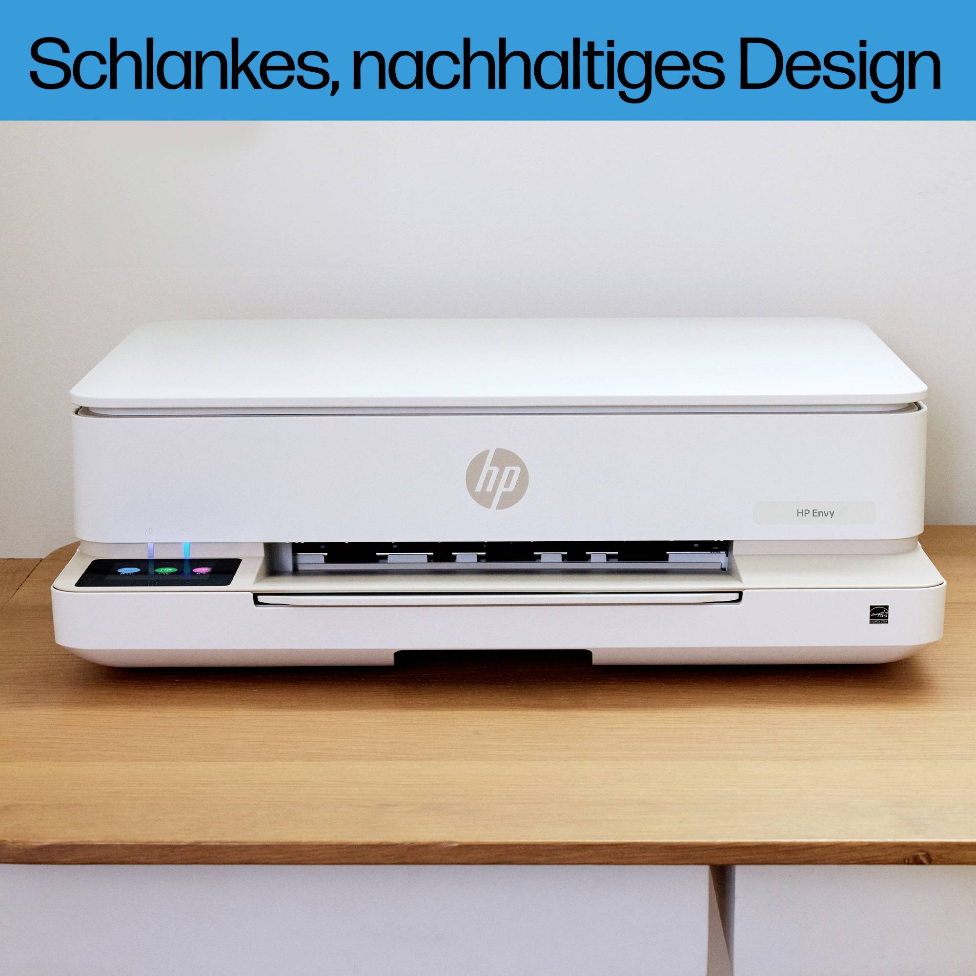 A white printer with a sleek design sits on a wooden table in front of a white wall. Text at the top: 'Slim, sustainable design'.