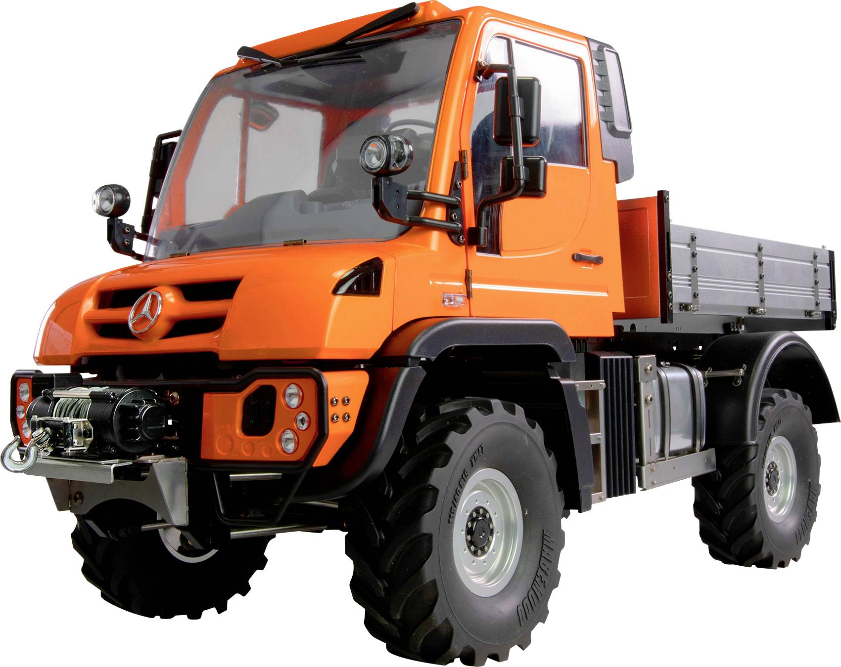 An orange lorry with high ground clearance and robust tyres, suitable for off-road use.