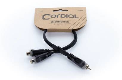 Y-cable by Cordial elements with three connectors: two female and one male. Cardboard packaging, minimalist design.