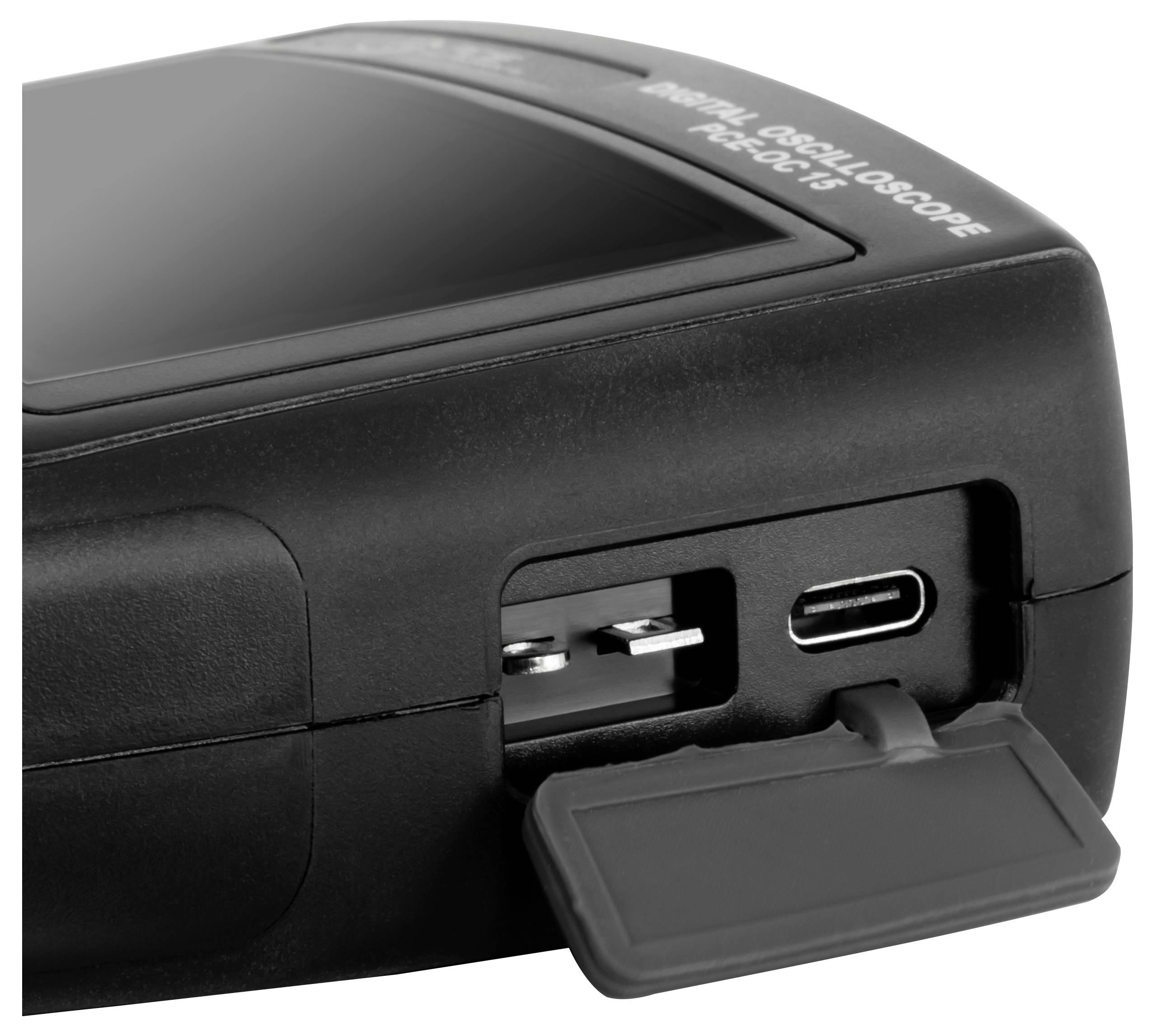 Close-up of a portable black digital oscilloscope showing side ports and a hinged rubber cover over the connectors.