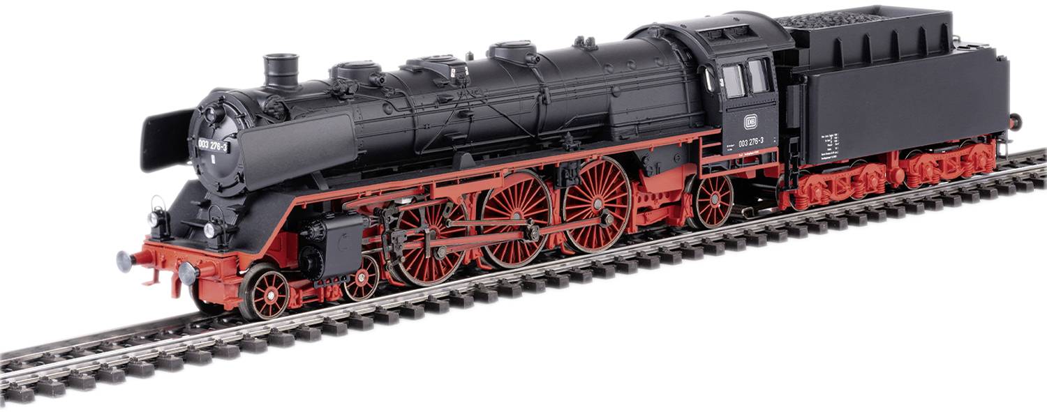 A black model of a steam locomotive with a red chassis is travelling on a track. The locomotive has numerous details and markings.