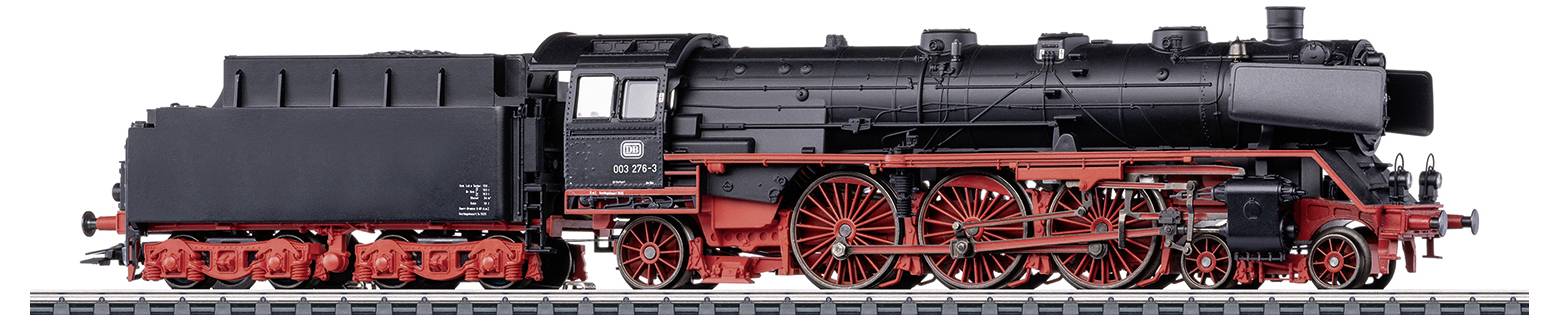 A model of a historical steam locomotive with red wheels and a black boiler, positioned on a railway track.