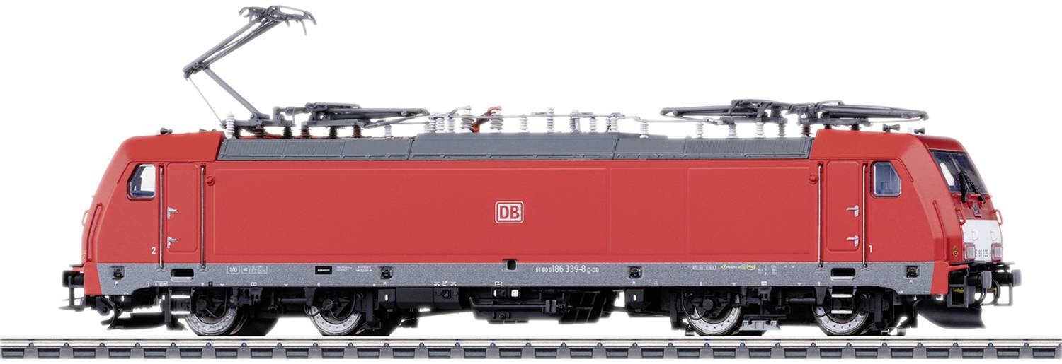 A red freight train from Deutsche Bahn with visible pantographs on a railway track.