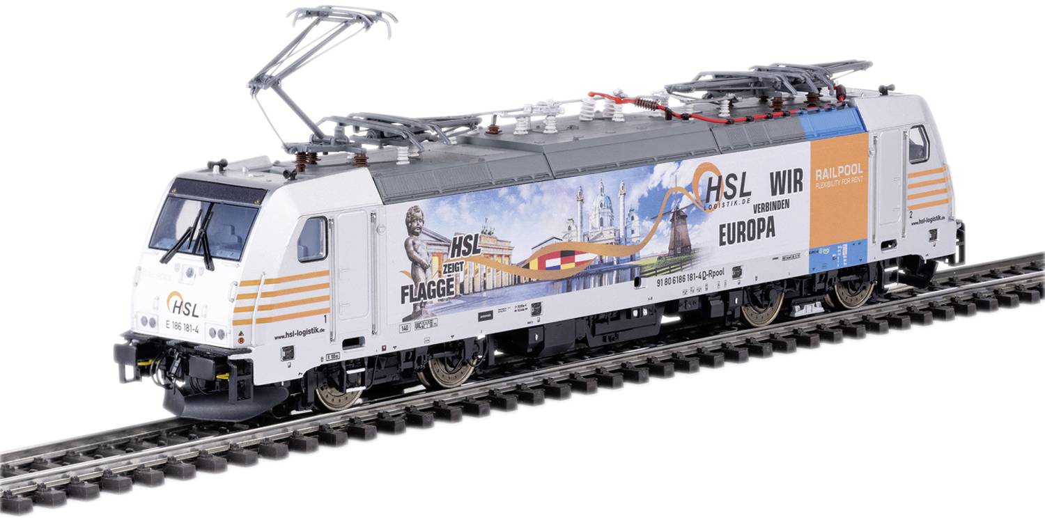 A white freight train with advertising banners travels along a track. On one side European landmarks can be seen, and on the other side orange patterns are visible.