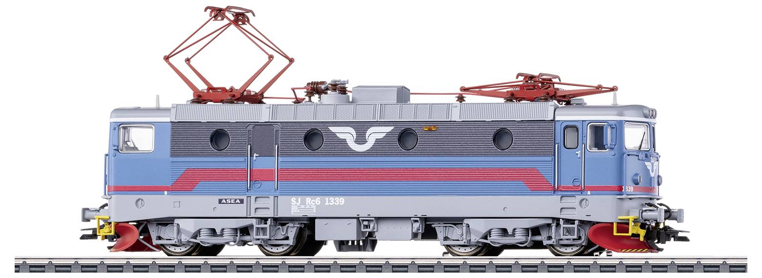 A model of a blue and grey electric locomotive with red details and a characteristic logo on the side. The locomotive is standing on railway tracks.