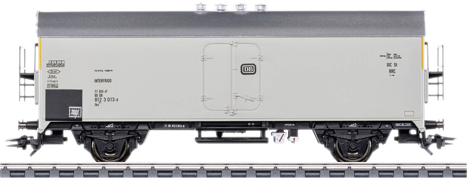 Grey model goods wagon on a track with detailed lettering and DB logo.