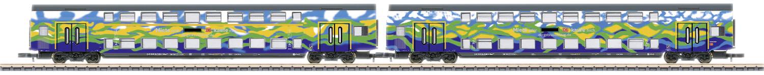 A train adorned with colourful graffiti travels along the tracks. The design features abstract blue, yellow, and green patterns.