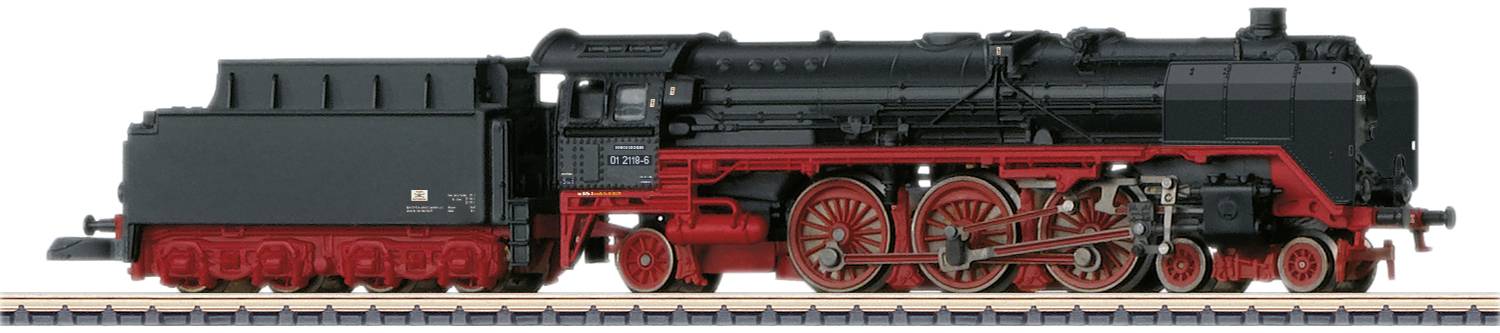 Black steam locomotive with red chassis on track. Side view reveals details such as wheels, boiler, and cab. Model railway.