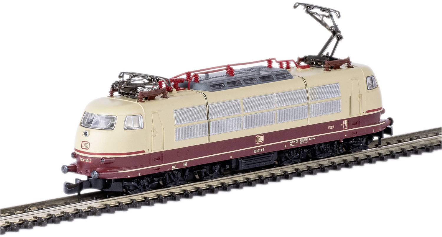 Model railway locomotive in beige and red on tracks, depicted with realistic details and overhead lines.