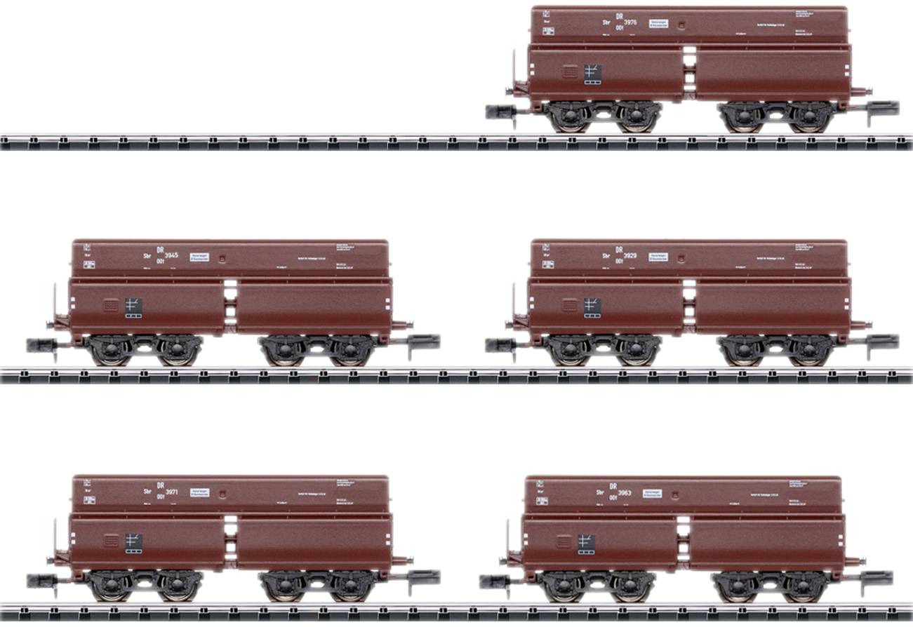 Six brown goods wagons in two rows side by side on a track. They are the same size and have red markings.