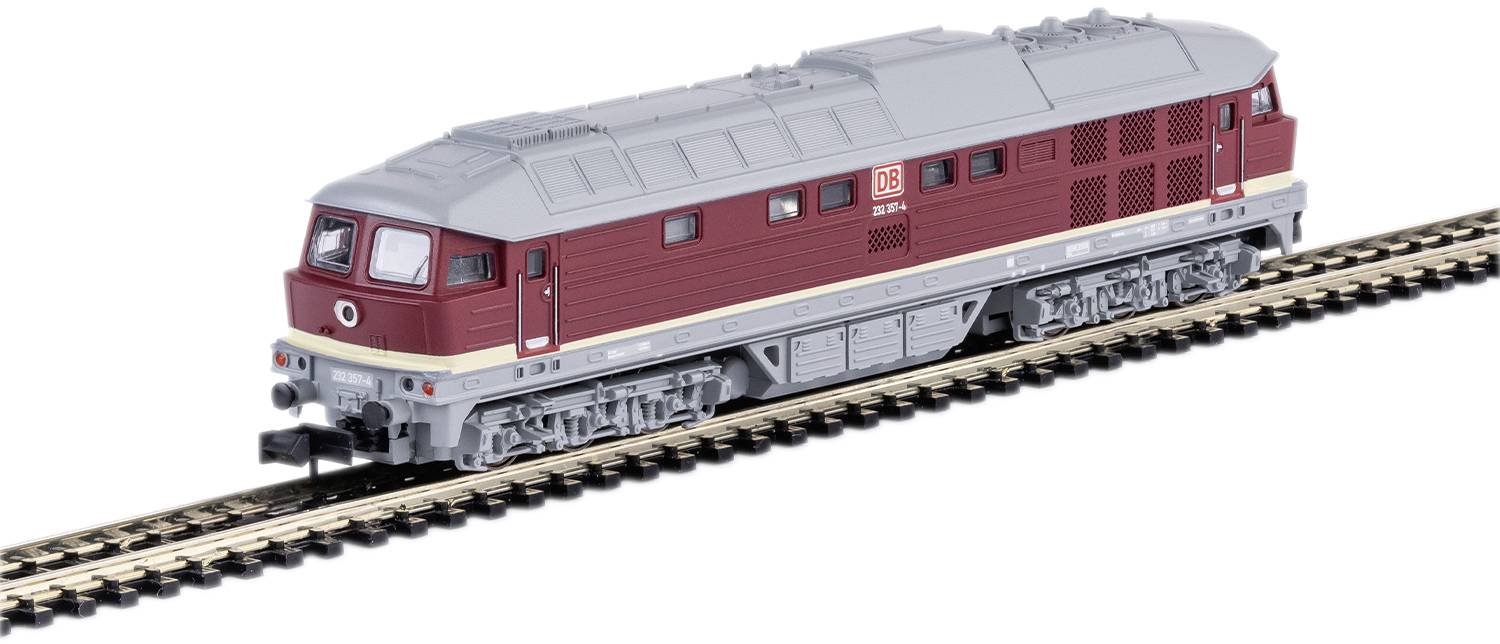 A model railway train with red and grey design, travelling on a track.