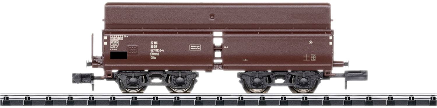 Brown model goods wagon on a track in 1:87 scale, side view, with detailed labelling and components.