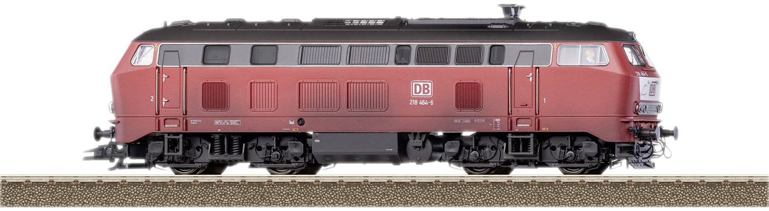 Red locomotive of Deutsche Bahn on a section of railway track, side view.