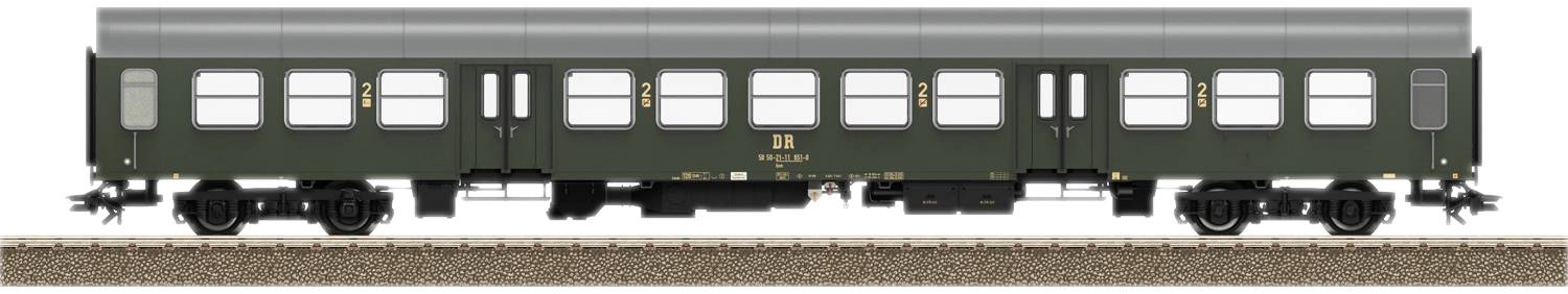 A green railway carriage on a track, with multiple windows and doors, side view.