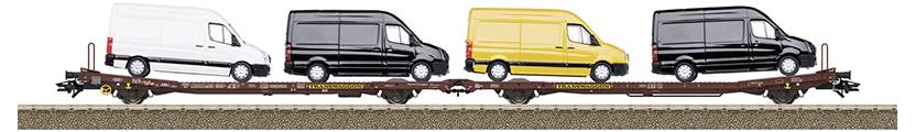Four transporters on a goods wagon, coloured: white, black, yellow, black.