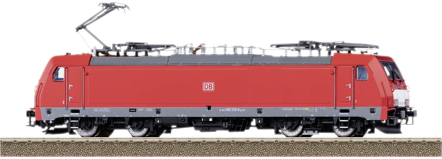 Red electric locomotive of Deutsche Bahn on a railway track.
