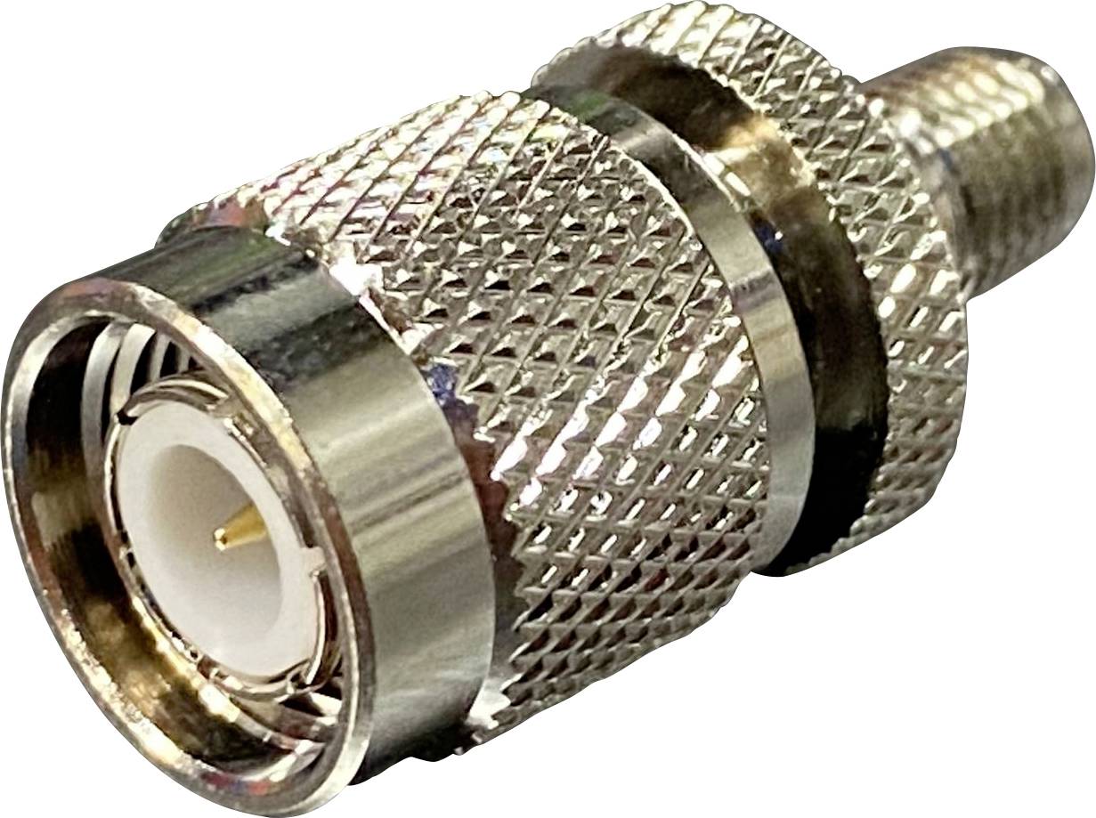 Metal adapter with knurled surface, male connector on one side and female connector on the other side, for coaxial cable.