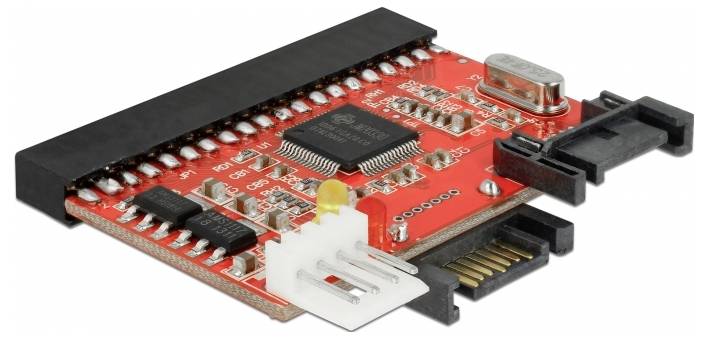 A red printed circuit board with multiple electronic components, including a central chip and connection ports, used in computers.