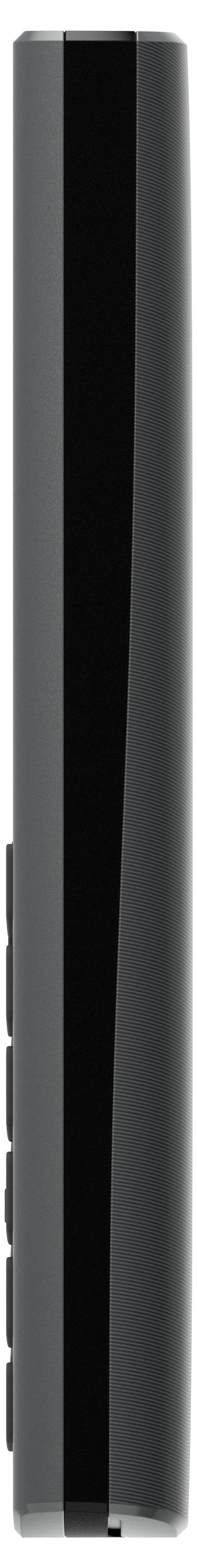 A thin, black electronic device, viewed vertically from a side perspective, with a smooth surface.