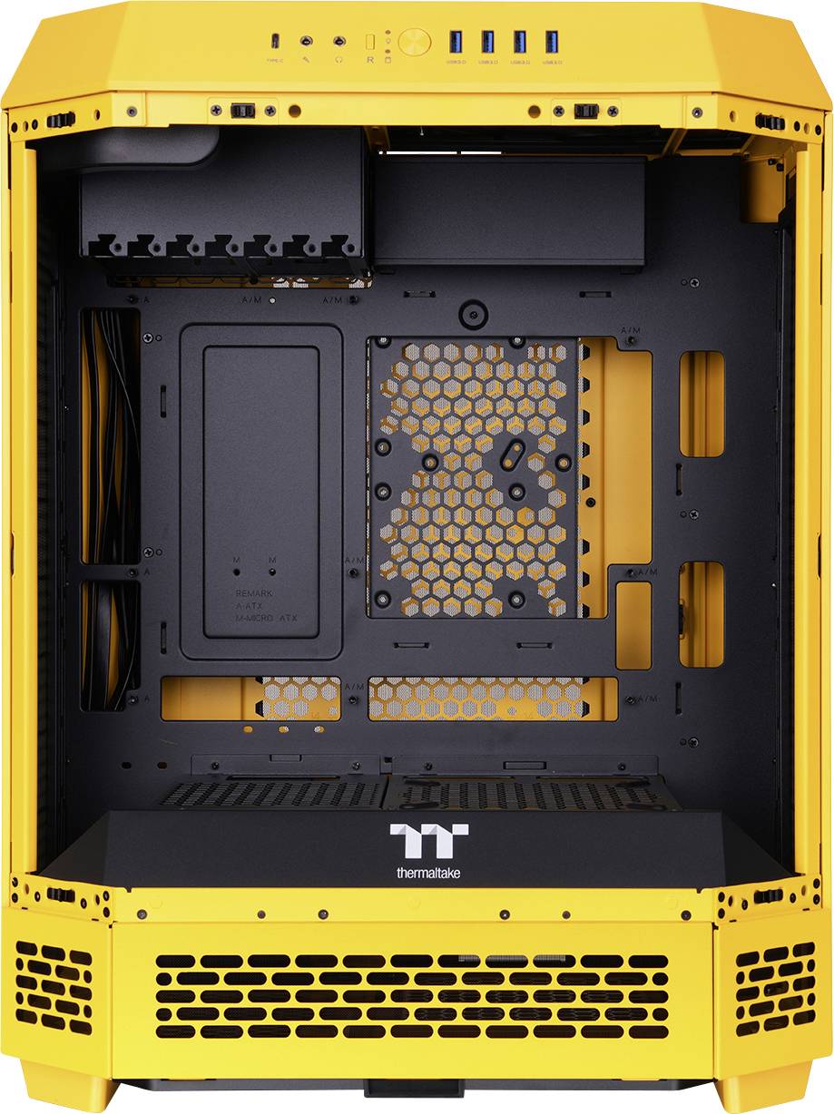 An open, empty computer case in yellow with a black internal frame, various mounting points, and ventilation grilles.