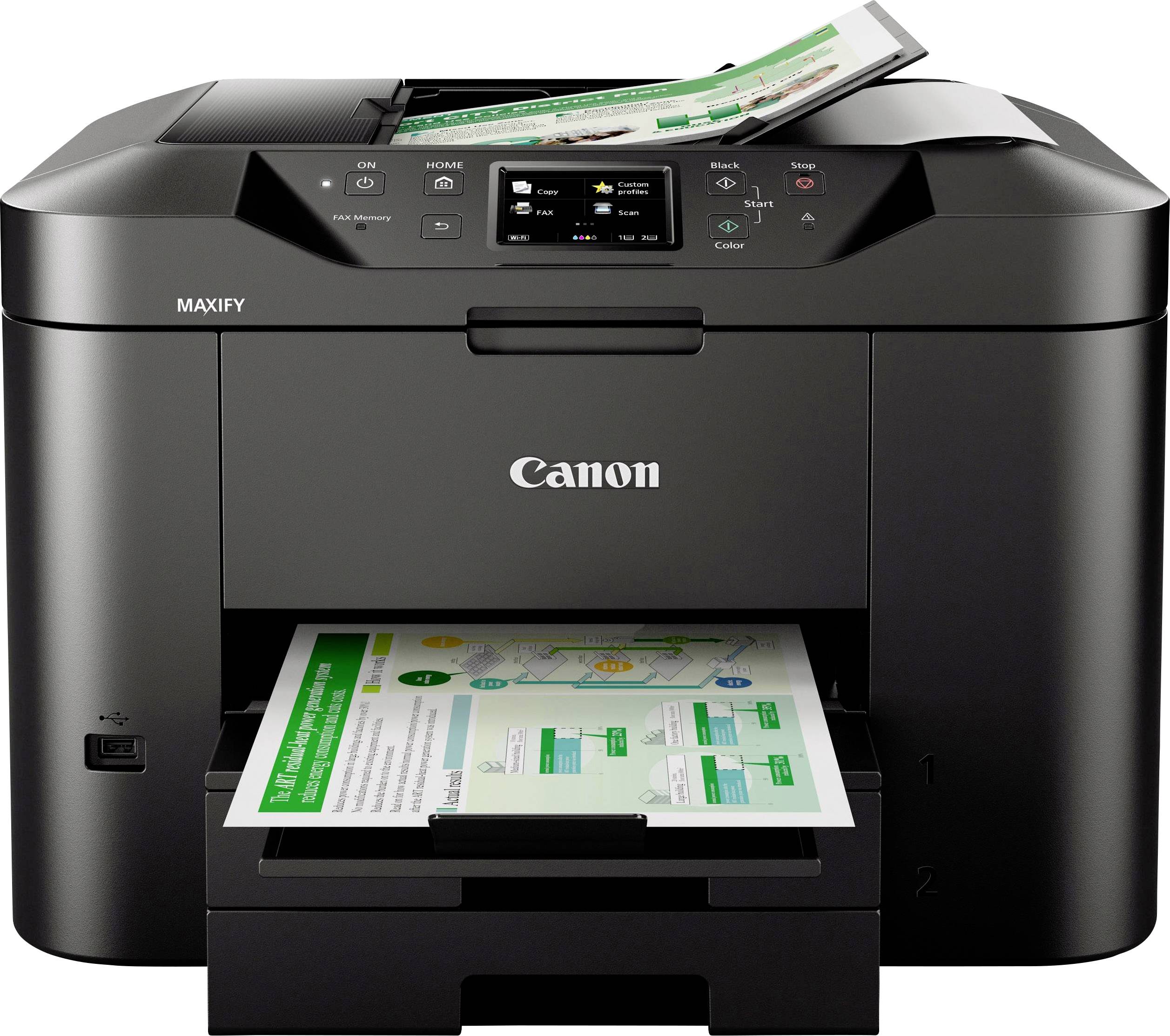 A black multifunction Canon printer is printing a sheet with diagrams and text in colour. Another sheet is lying on top.