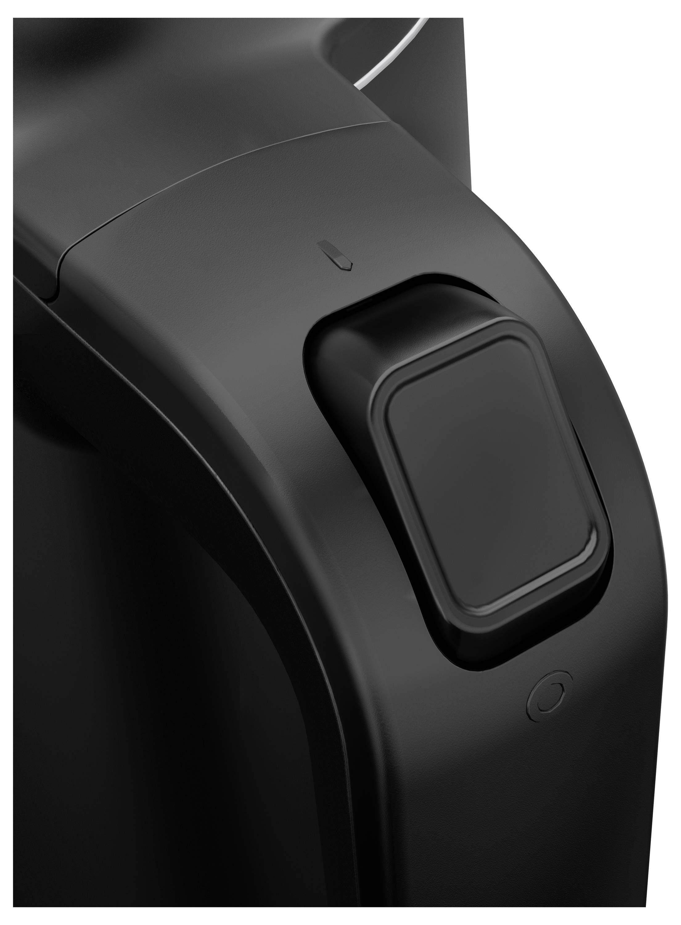 Close-up of a black switch on a device. The switch is rectangular, with a small marking located in the top left corner.