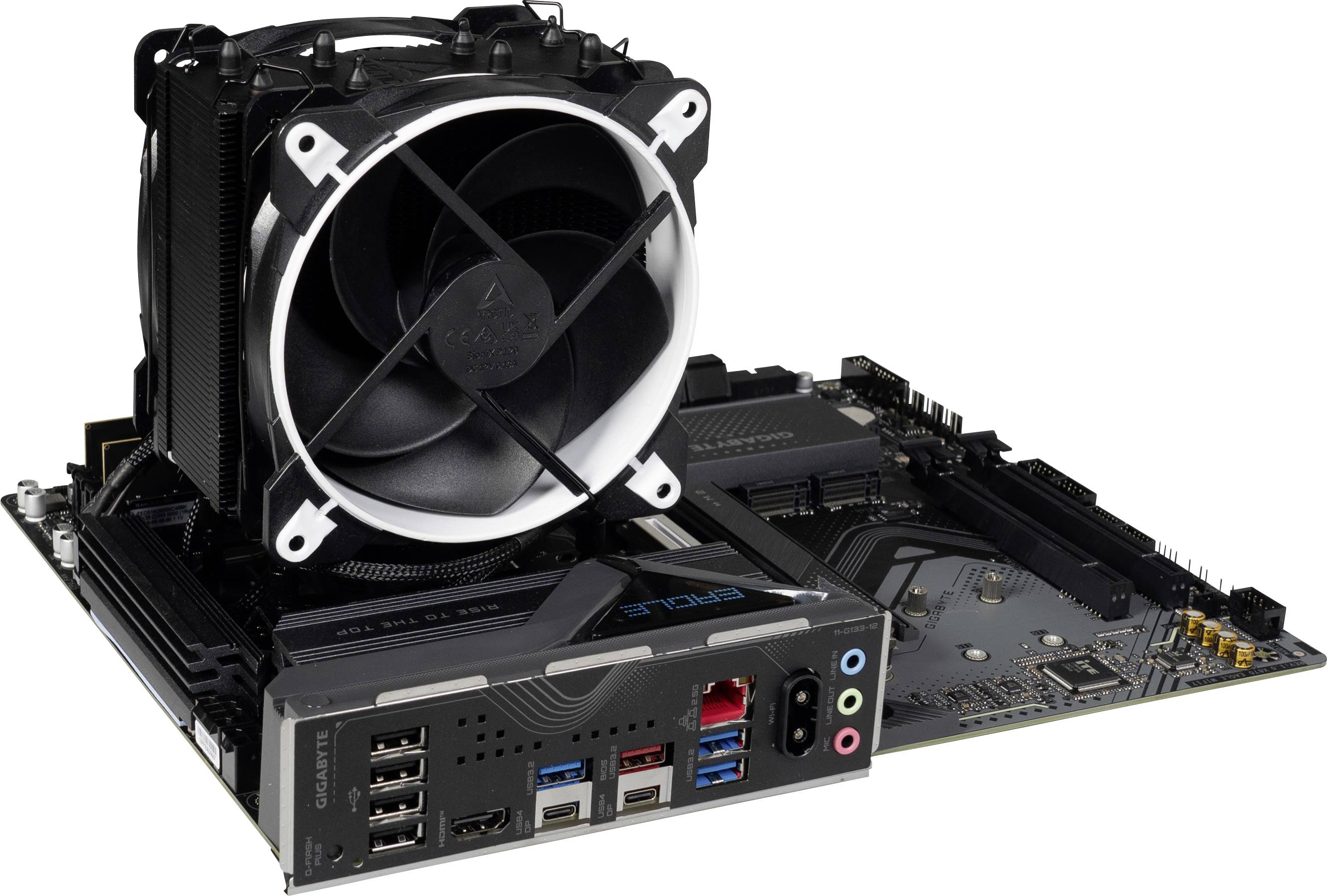 A computer motherboard with an attached fan and various ports, including USB ports and audio connections, on a white background.