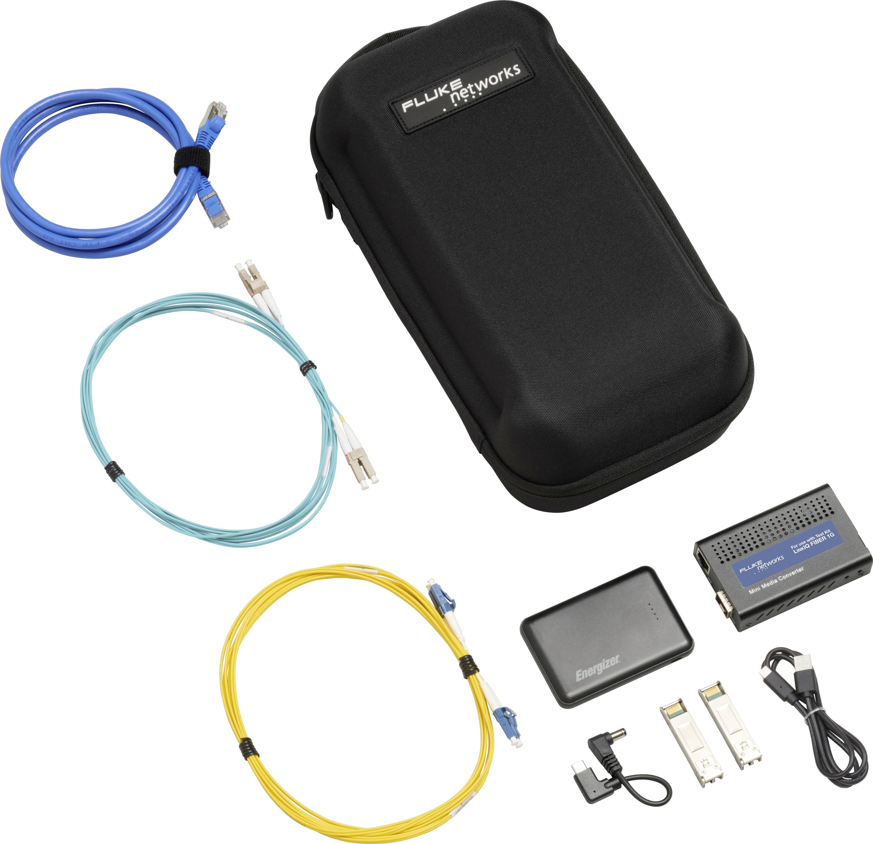 A black Fluke Networks bag containing coloured cables, a module, batteries, and adapters shows a network test kit.