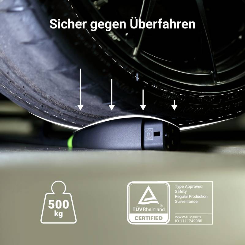 'Robust device under a car tyre, titled 'Safe Against Being Driven Over'. TÜV Rheinland certified for 500 kg load.'