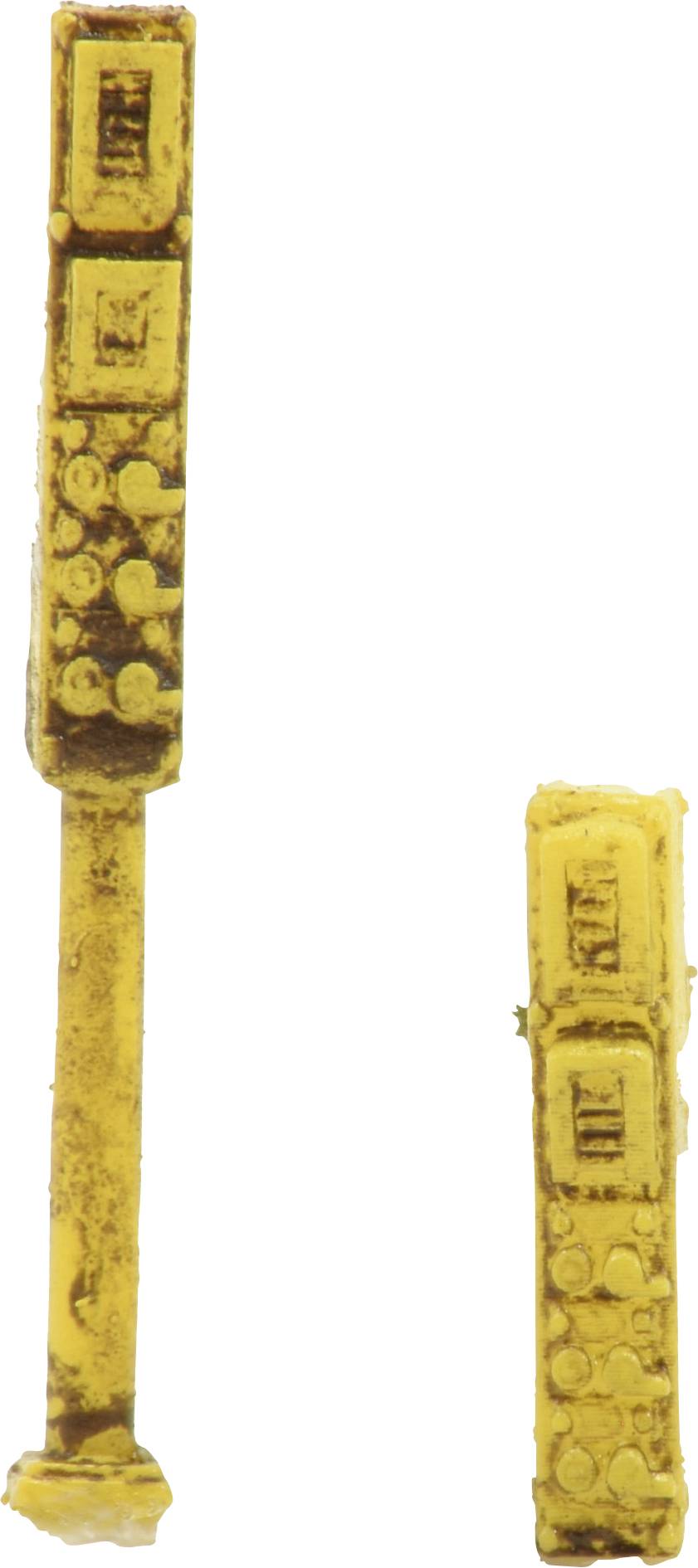 Two yellow, elongated electronic components, similar in shape to resistors or capacitors, on a white background.