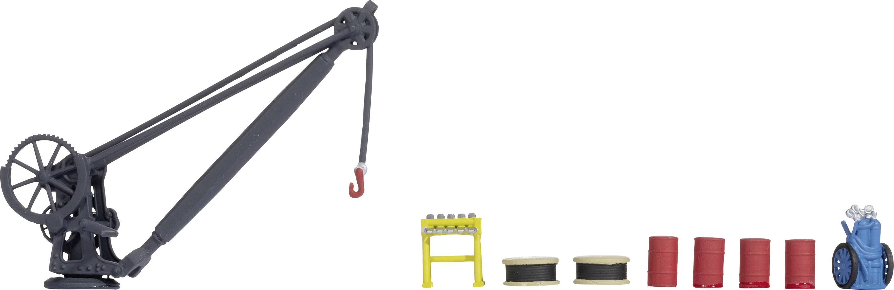 A model crane with a red hook on the left. On the right, yellow beams, spools, red barrels, and a blue machine component are arranged.