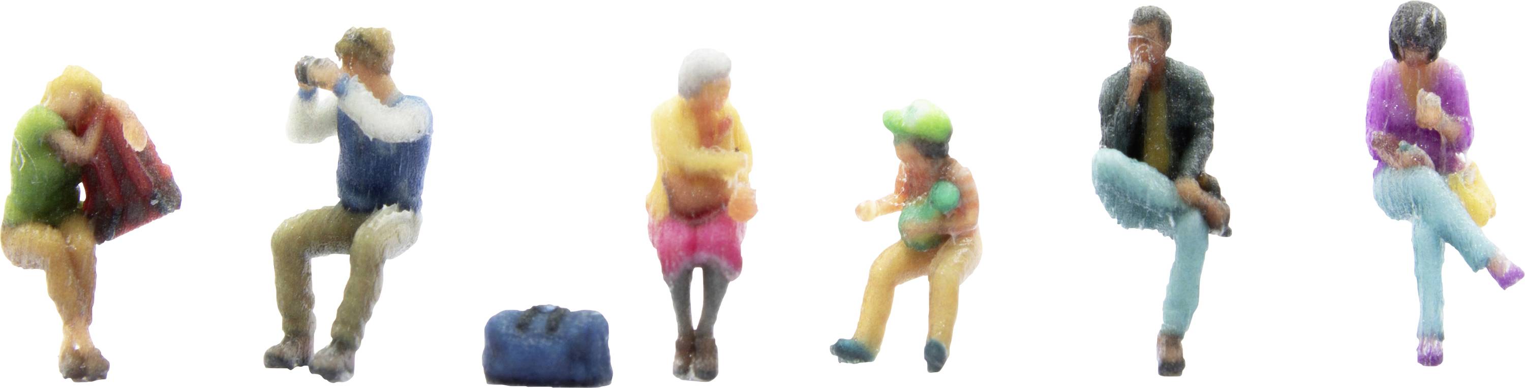 Six miniature figures of different age groups sit in various poses.