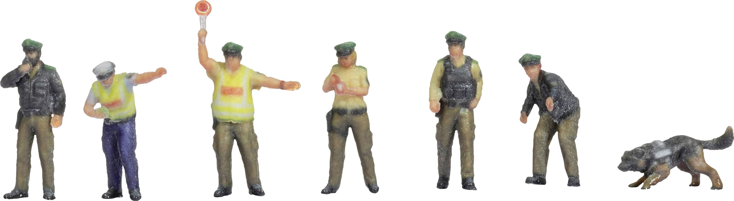 Several miniature figurines of police officers in various poses, one holding up a traffic sign, with a sniffer dog beside them.