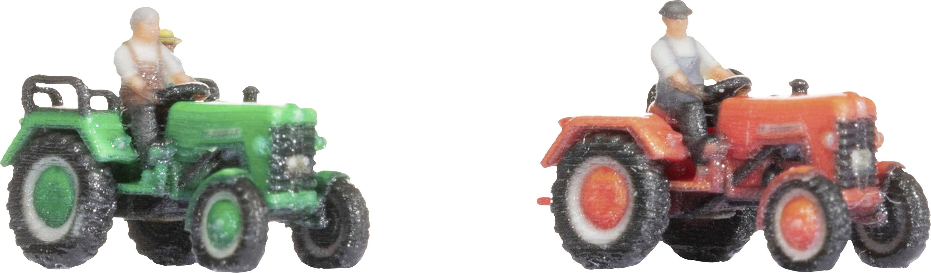 Two toy tractors with drivers: One in green, one in red. Both drivers are wearing grey clothing and are seated on the tractors.