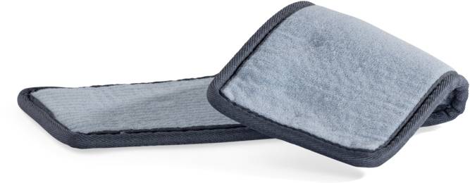 A blue, rectangular cushion with dark-edged borders lies on a white surface.