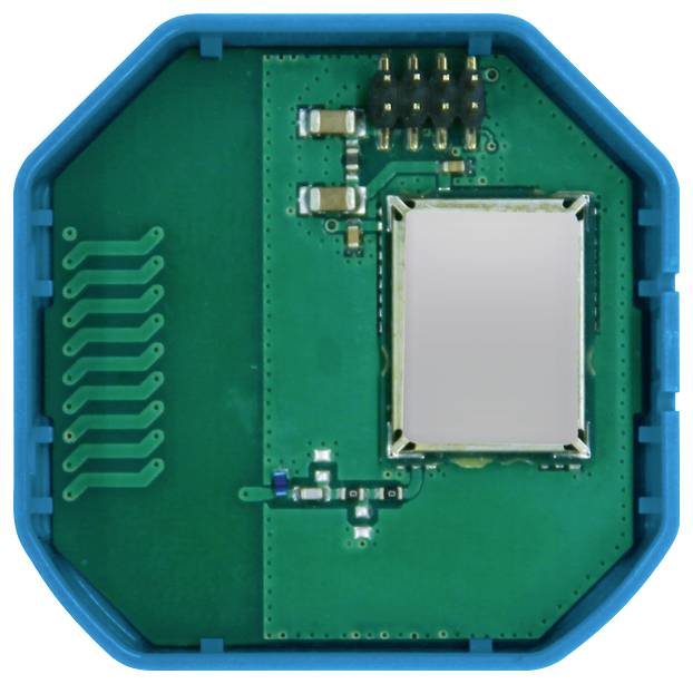 An open, octagonal blue enclosure with a green circuit board and several electronic components, including a silver module.