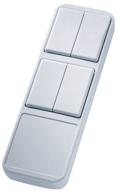 A rectangular, silver remote control device with four rectangular buttons, arranged in two rows. It appears compact and handy.