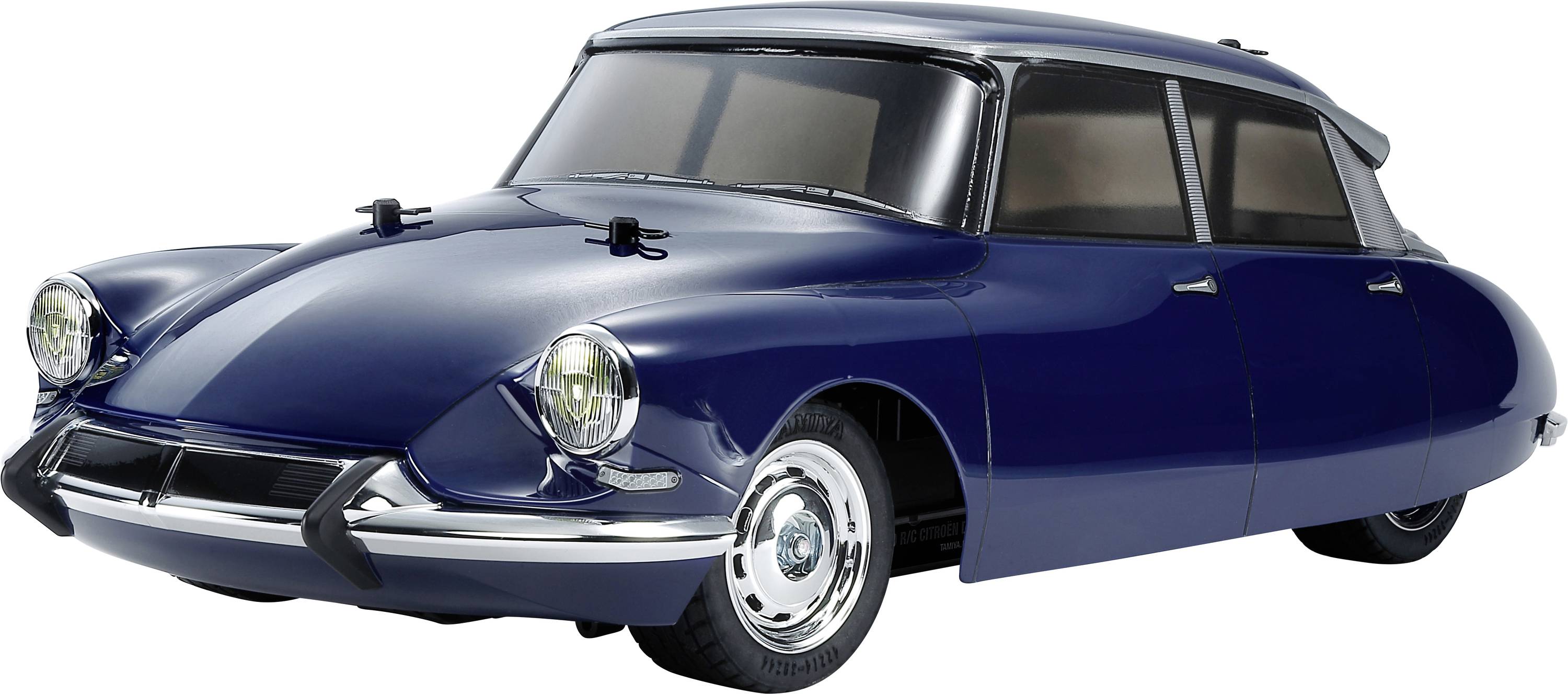Blue model car in a retro style, reminiscent of vintage car designs. It features an aerodynamic body and round headlamps.